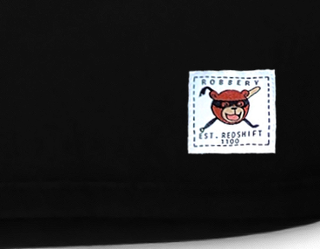 Robbery woven hem label close-up — bear mascot, EST. REDSHIFT 1100